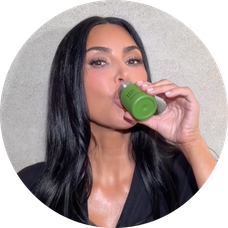 Kim Kardashian drinks Broc Shot from a green bottle