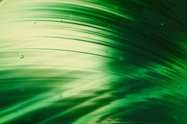 Abstract glowing green spheres representing sulforaphane