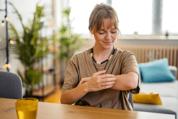 A Woman’s Arm Showing Noticeable Improvement After Taking Supplements For Psoriasis 
