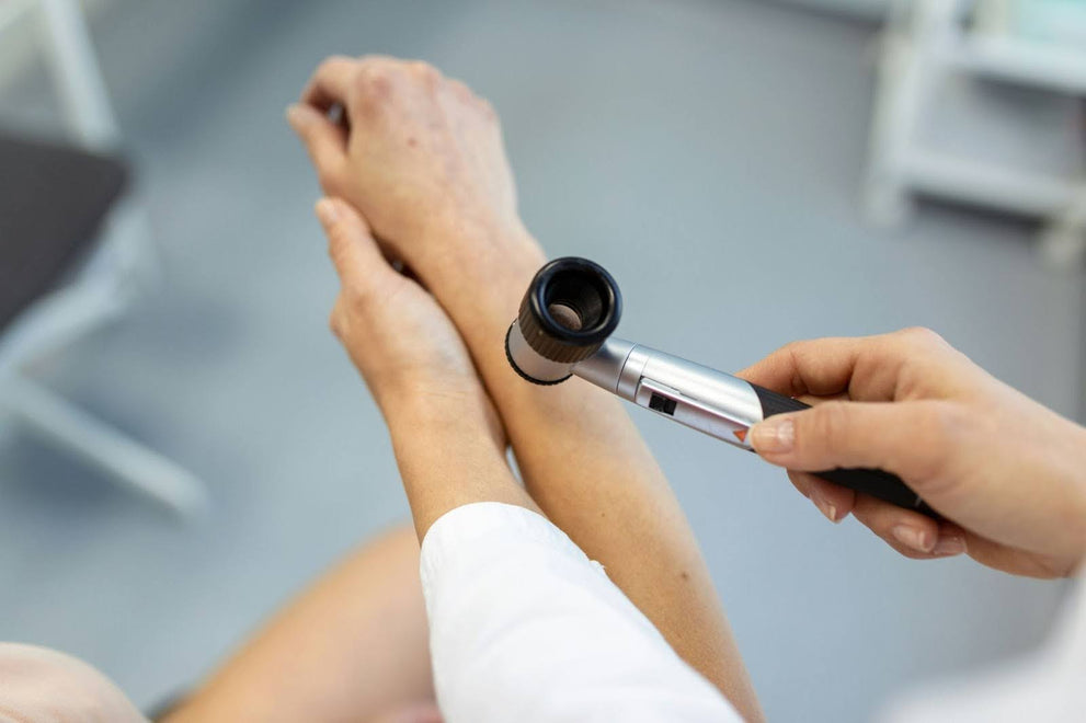 Doctor Examining Patient For Psoriasis